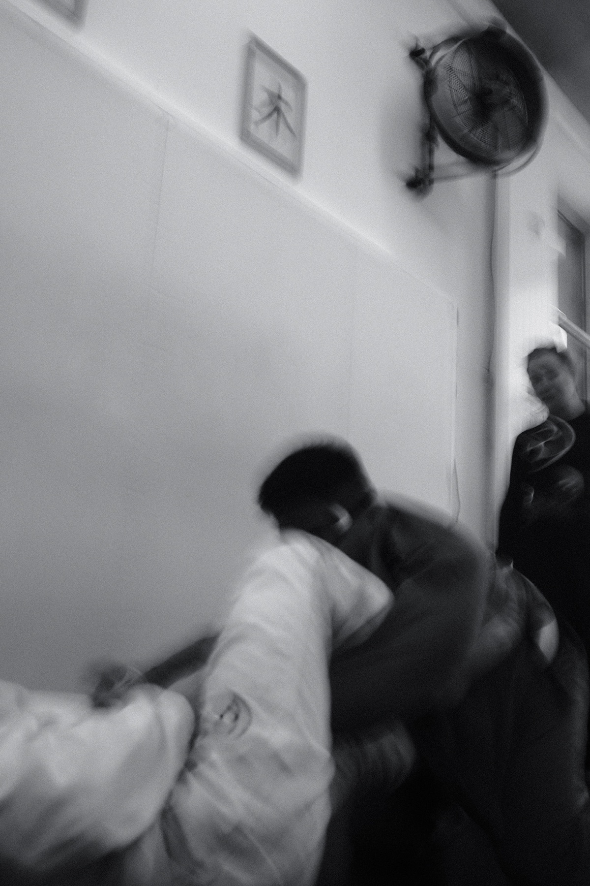 A close view of two practitioners training a ground position