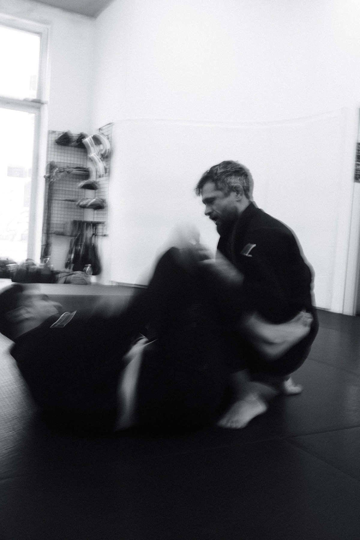 Jiu-jitsu partners sparring in motion