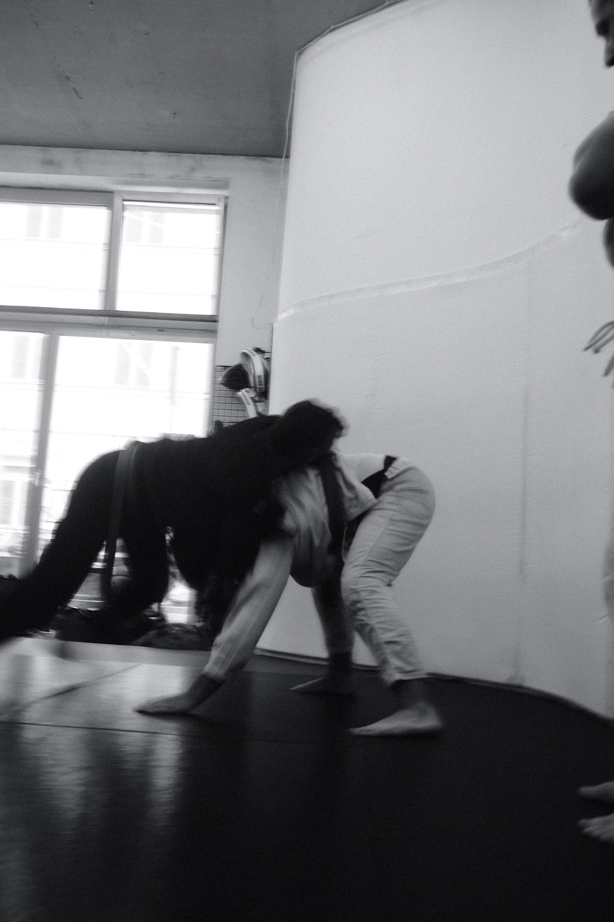 Two practitioners working through a standing grappling exchange